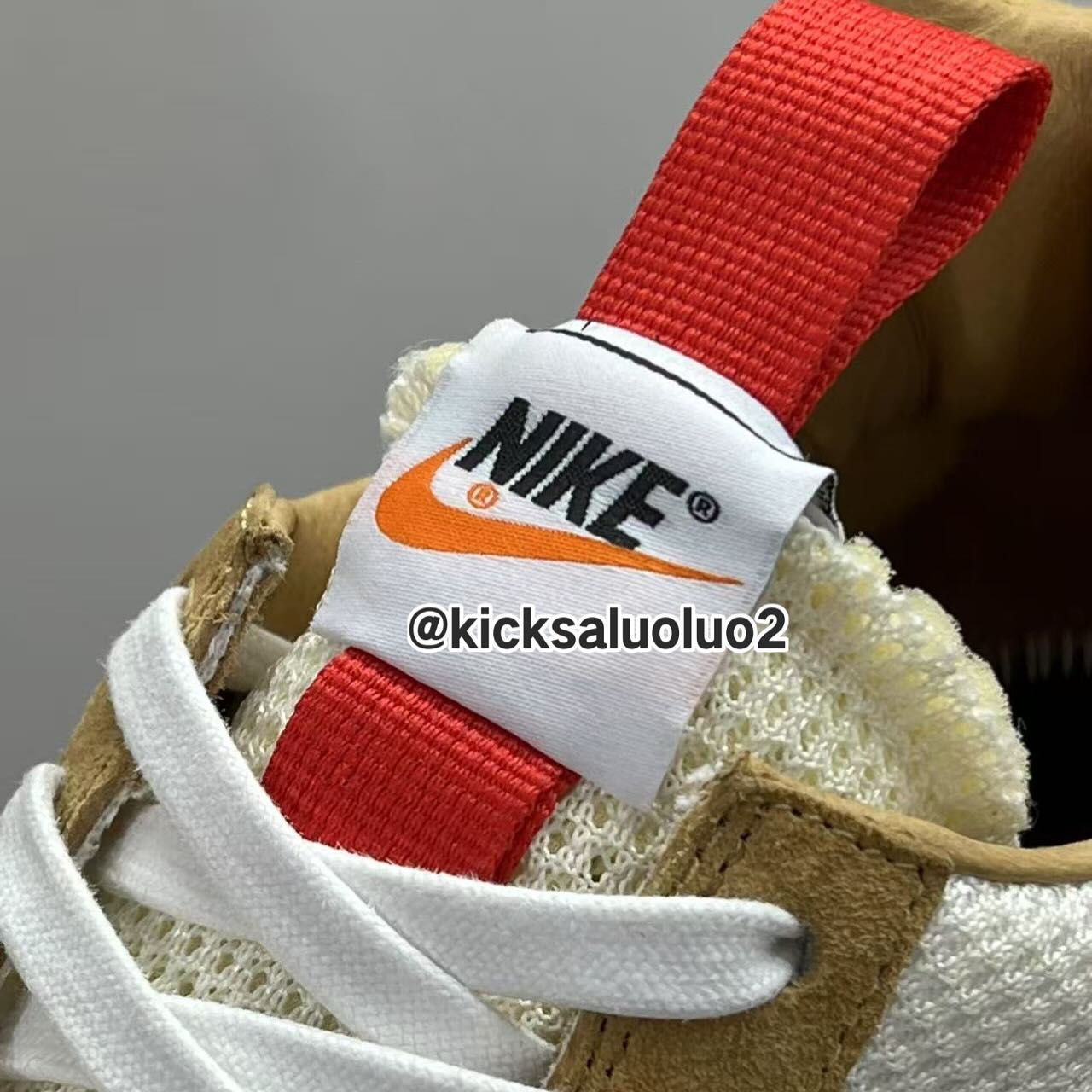 Tom Sachs x Nike Mars Yard 3.0 Close-up of tongue label on the Tom Sachs x Nike Mars Yard 3.0 with red pull tab and Nike logo.