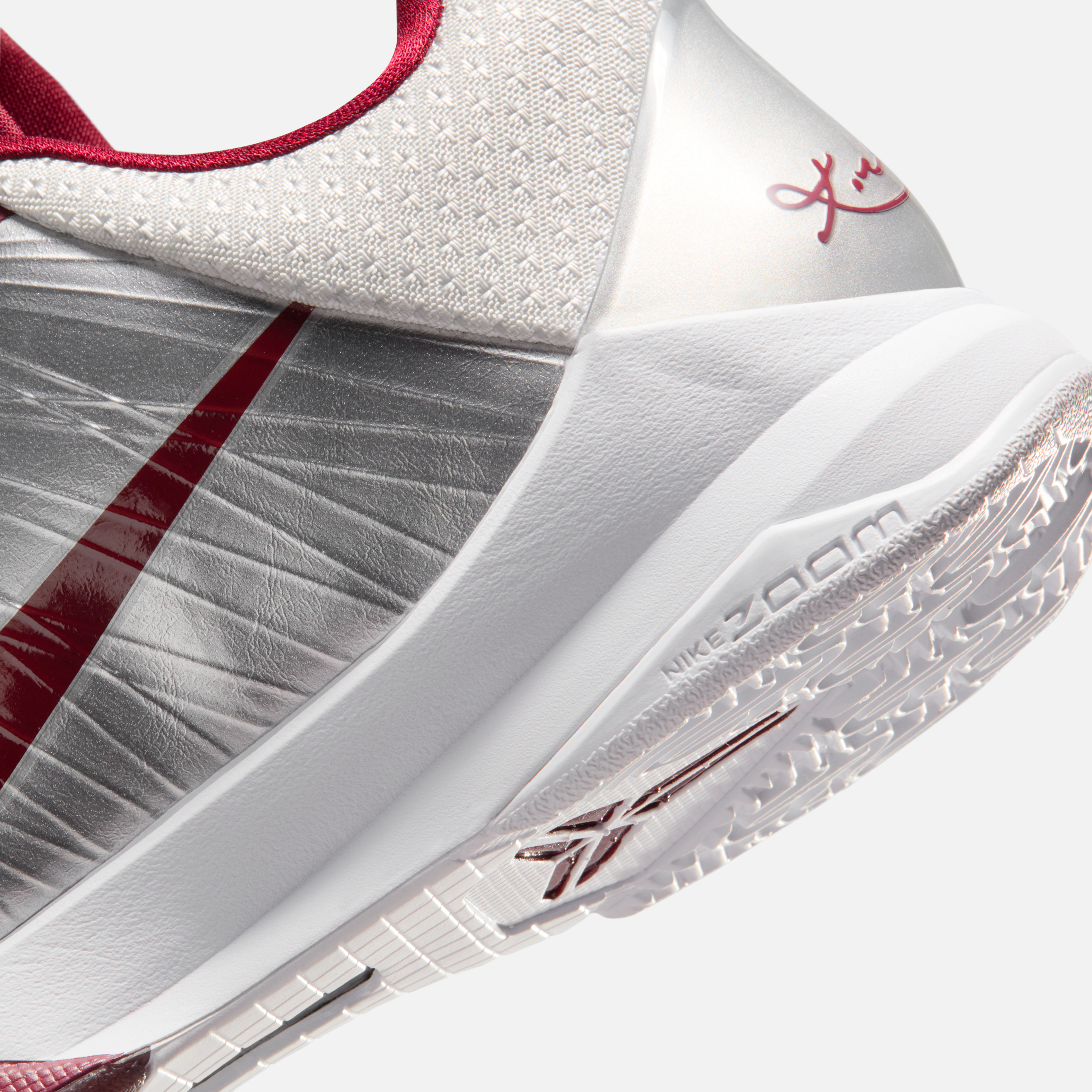 Side view of the Nike Kobe 5 Protro “Lower Merion Away” with silver-red upper and Swoosh