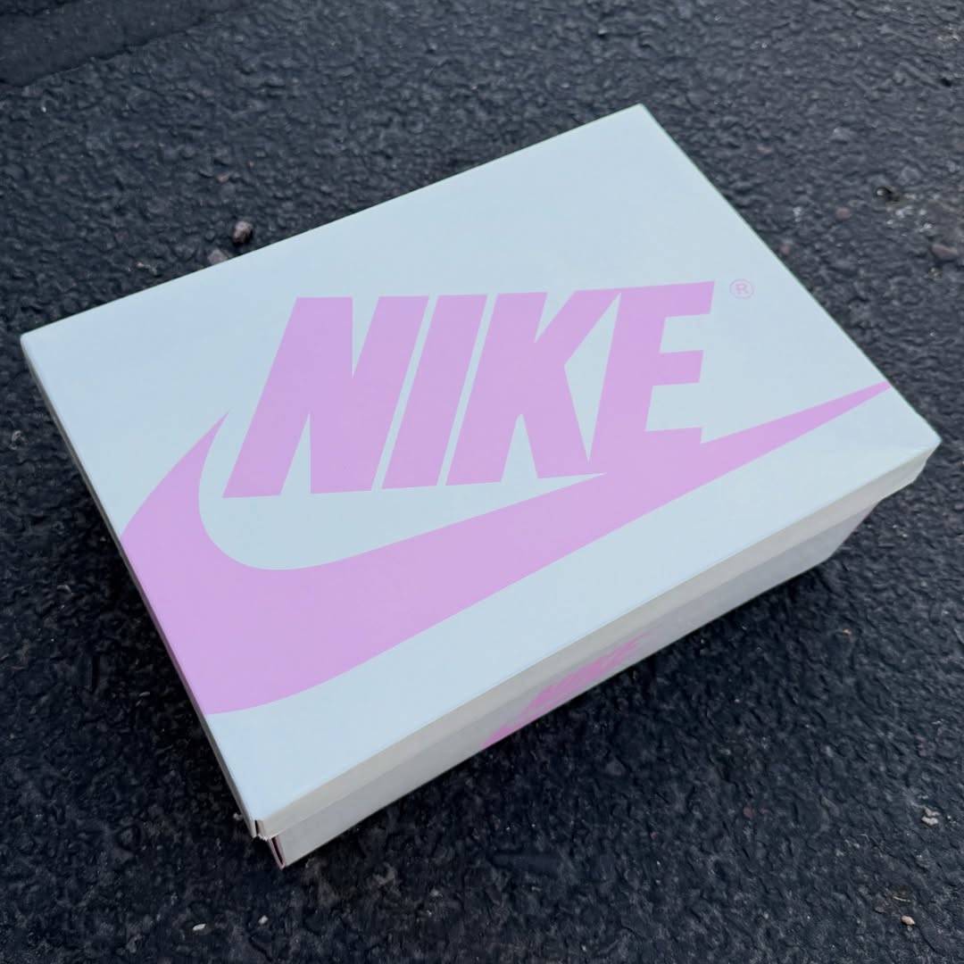 Close-up of the Air Jordan 1 Low OG “Shy Pink” in hand
