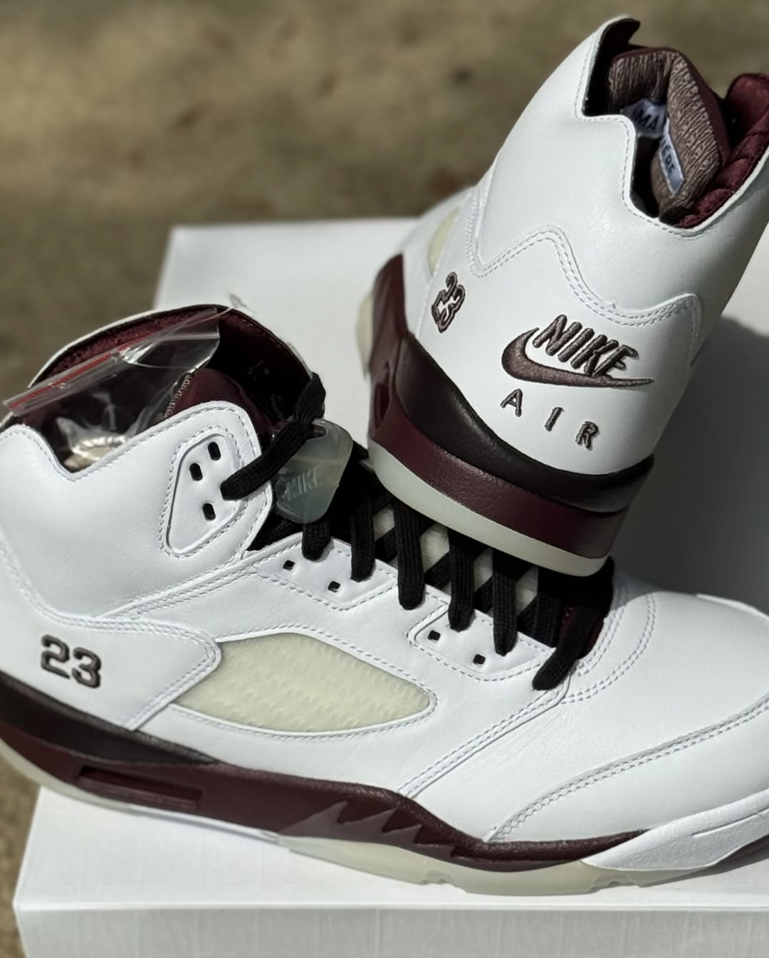 Side angle showcasing the burgundy midsole on the A Ma Maniére Air Jordan 5 Violet Ore