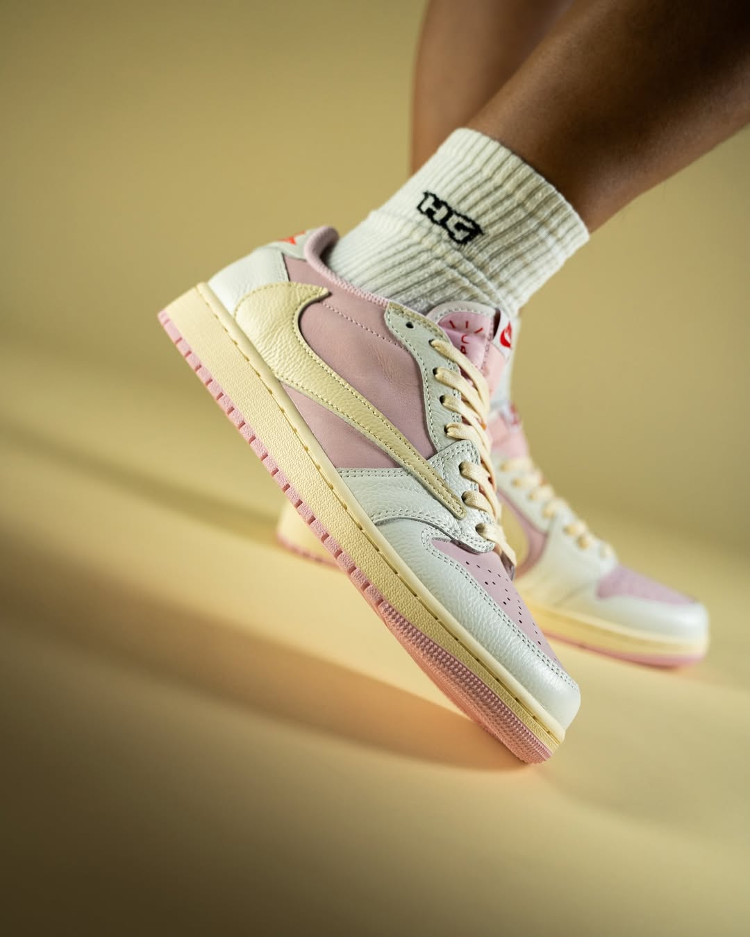 Travis Scott x Air Jordan 1 Low "Shy Pink" Close-up of the Air Jordan 1 Low OG “Shy Pink” on Travis Scott’s feet