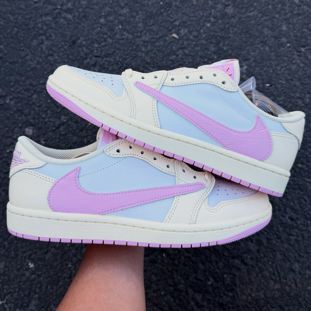 Close-up of the Air Jordan 1 Low OG “Shy Pink” in hand