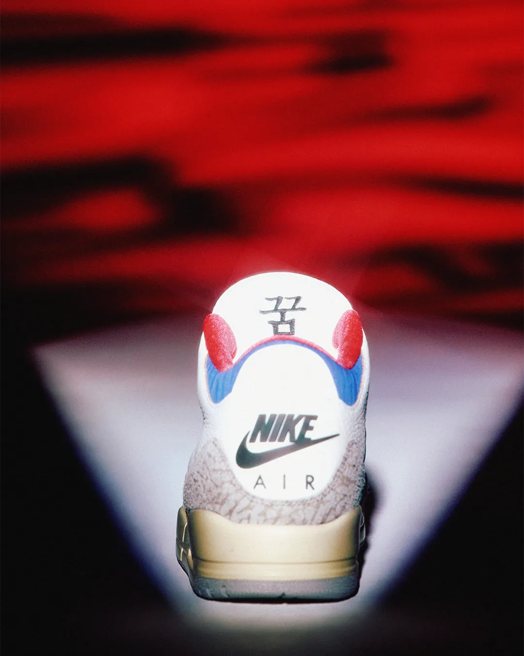 Close-up of Air Jordan 3 Seoul 2.0 tongue logo featuring the Taegeuk symbol