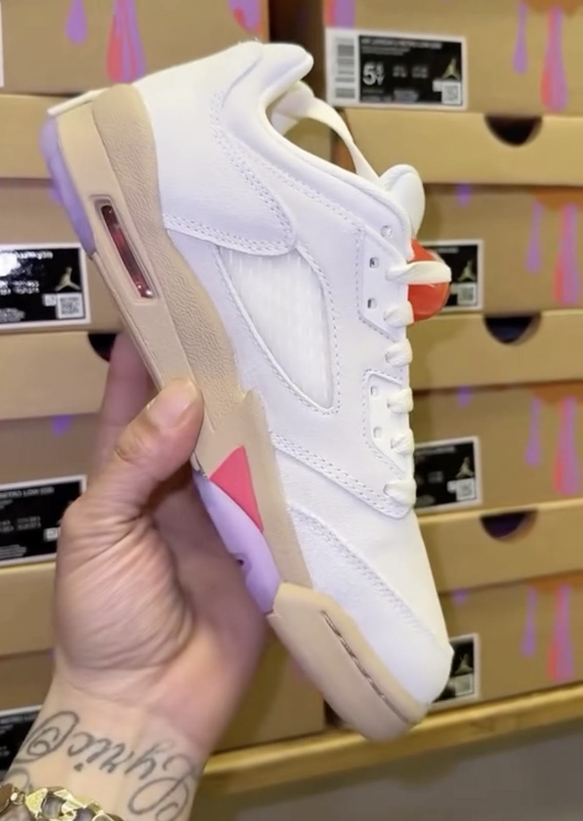 Side view of Air Jordan 5 Low GS Peanut Butter & Jelly sneaker with translucent outsole