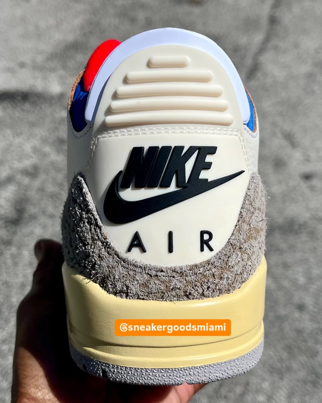 Heel view of Air Jordan 3 OG Seoul 2.0 with black Nike Air logo on suede panel