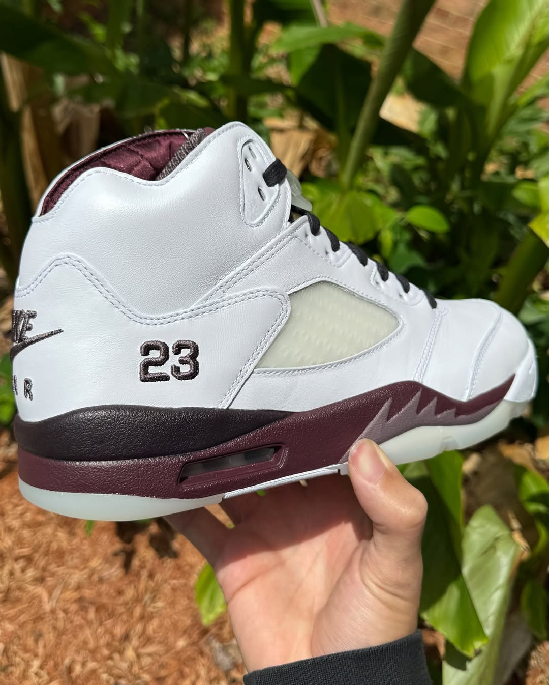 Side angle showcasing the burgundy midsole on the A Ma Maniére Air Jordan 5 Violet Ore