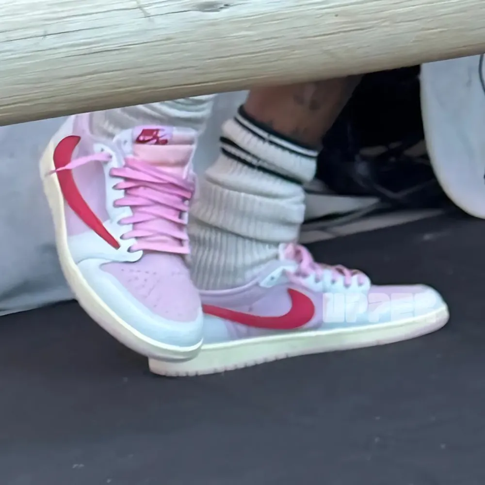Travis Scott x Air Jordan 1 Low "Shy Pink" Close-up of the Air Jordan 1 Low OG “Shy Pink” on Travis Scott’s feet