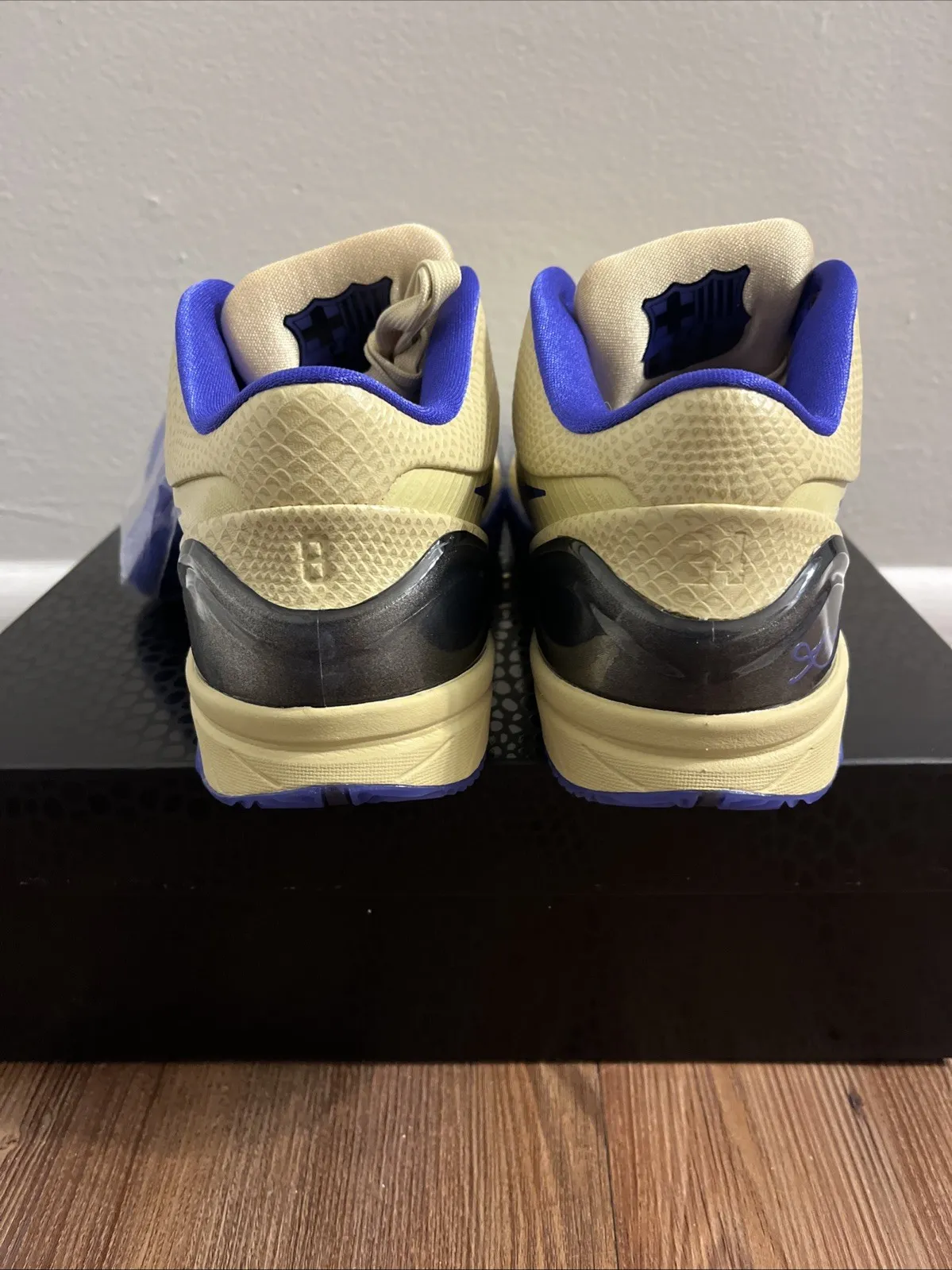 FC Barcelona x Nike Kobe 4 Protro Arts‑Rec x Nike SB Dunk Low in open beige sneaker box with safari print paper