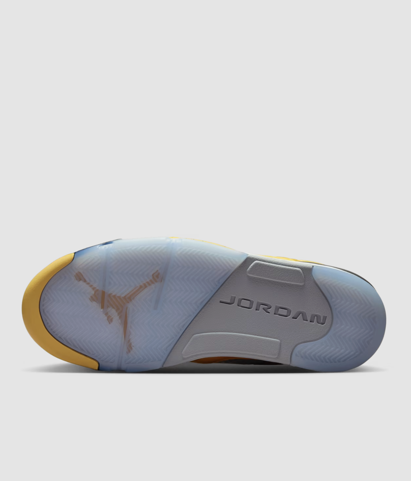 Side view of the Air Jordan 5 “Tokyo” featuring yellow upper and Tokyo 23 embroidery