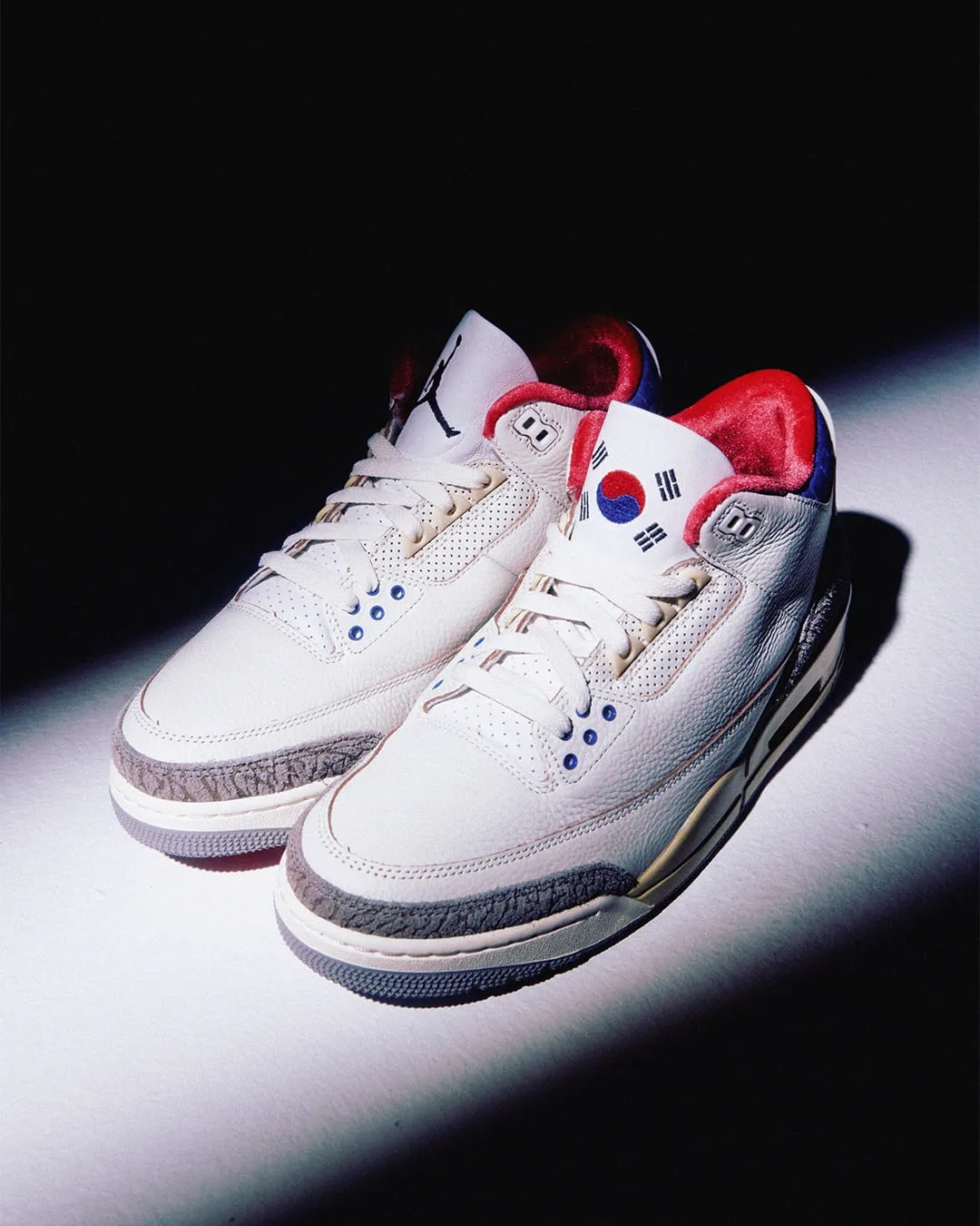 Close-up of Air Jordan 3 Seoul 2.0 tongue logo featuring the Taegeuk symbol