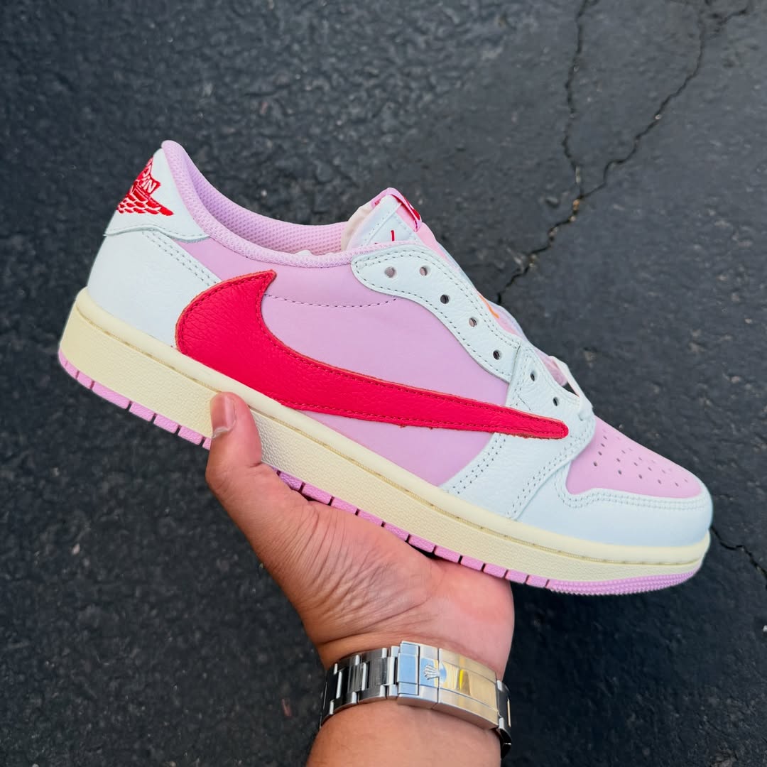 Travis Scott x Air Jordan 1 Low "Tropical Pink" in hand