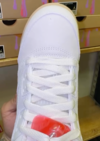 Front view of Air Jordan 5 Low GS Peanut Butter & Jelly showing laces and red lace lock