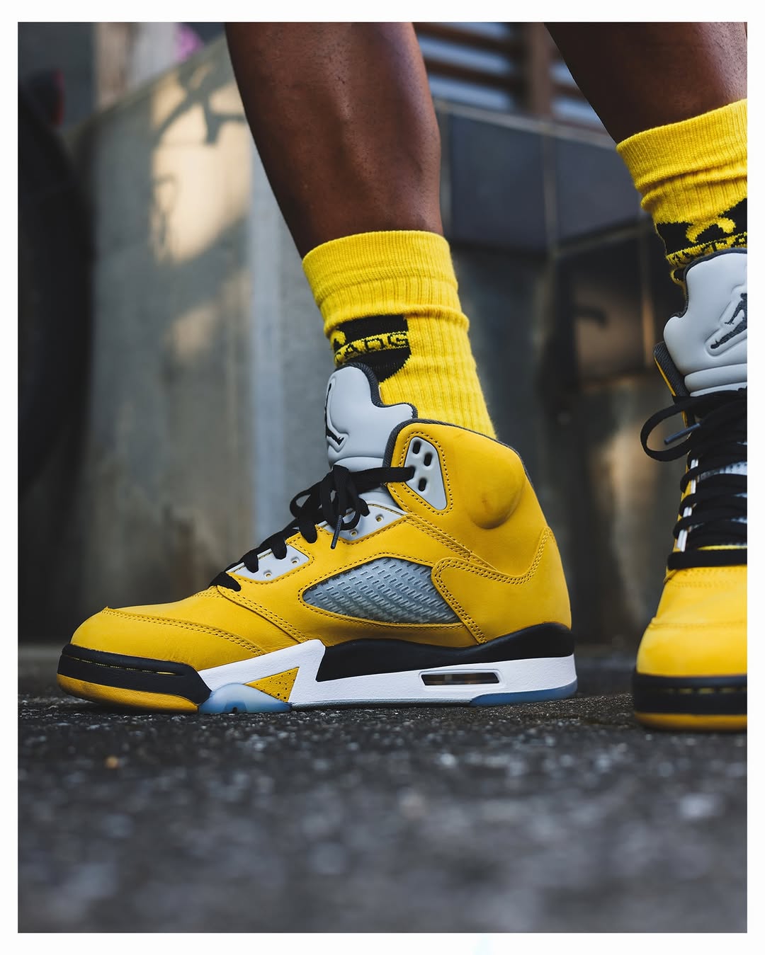 Side view of the Air Jordan 5 “Tokyo” featuring yellow upper and Tokyo 23 embroidery