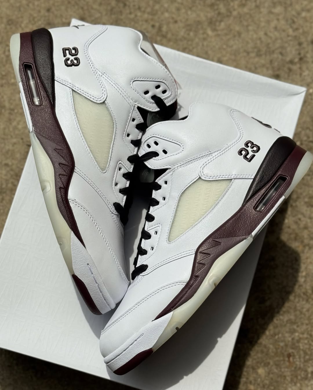 Side angle showcasing the burgundy midsole on the A Ma Maniére Air Jordan 5 Violet Ore