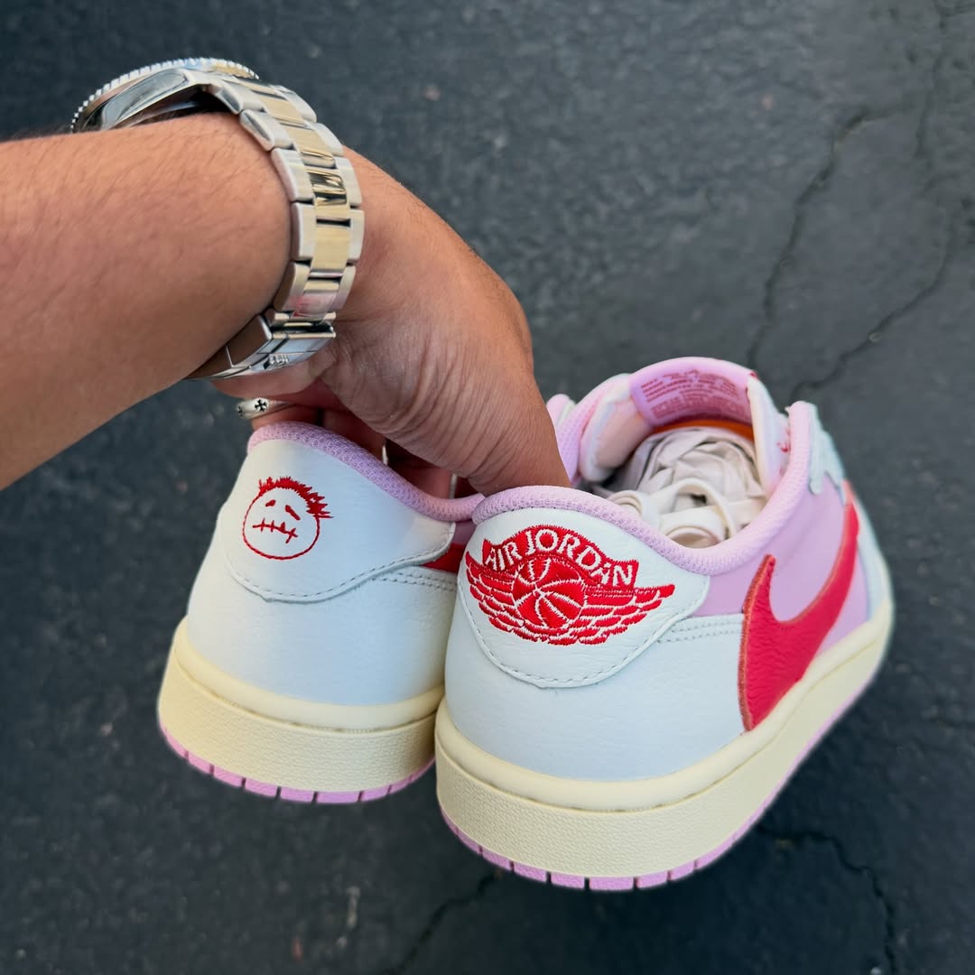 Travis Scott x Air Jordan 1 Low "Tropical Pink" in hand