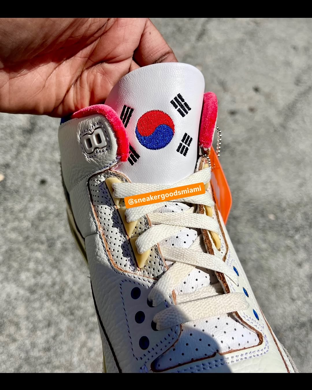 Close-up of Air Jordan 3 Seoul 2.0 tongue logo featuring the Taegeuk symbol