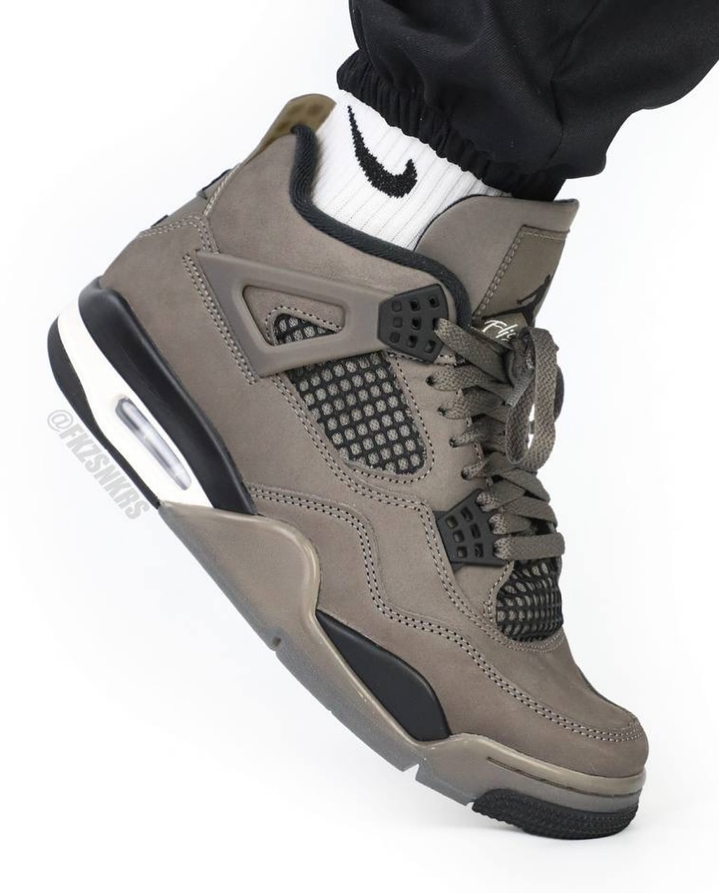 Air Jordan 4 Cave Stone Air Jordan 4 Cave Stone on-foot side view with brown suede and black mesh