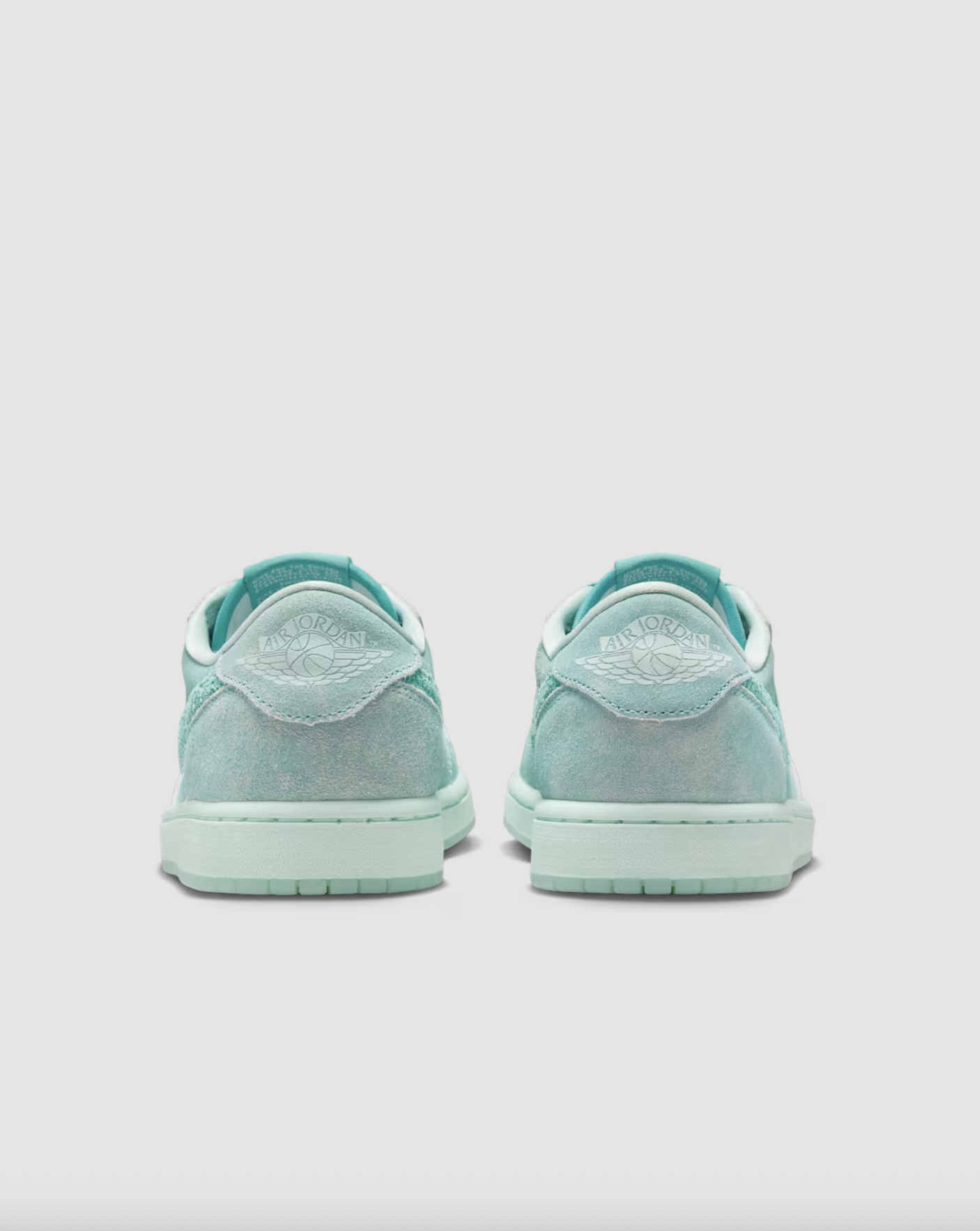 Heel view of the Air Jordan 1 Low “Washed Teal” W with Wings logo