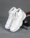Side view of the Air Jordan 11 “Grand Finale” featuring white patent leather and chrome Jumpman logo