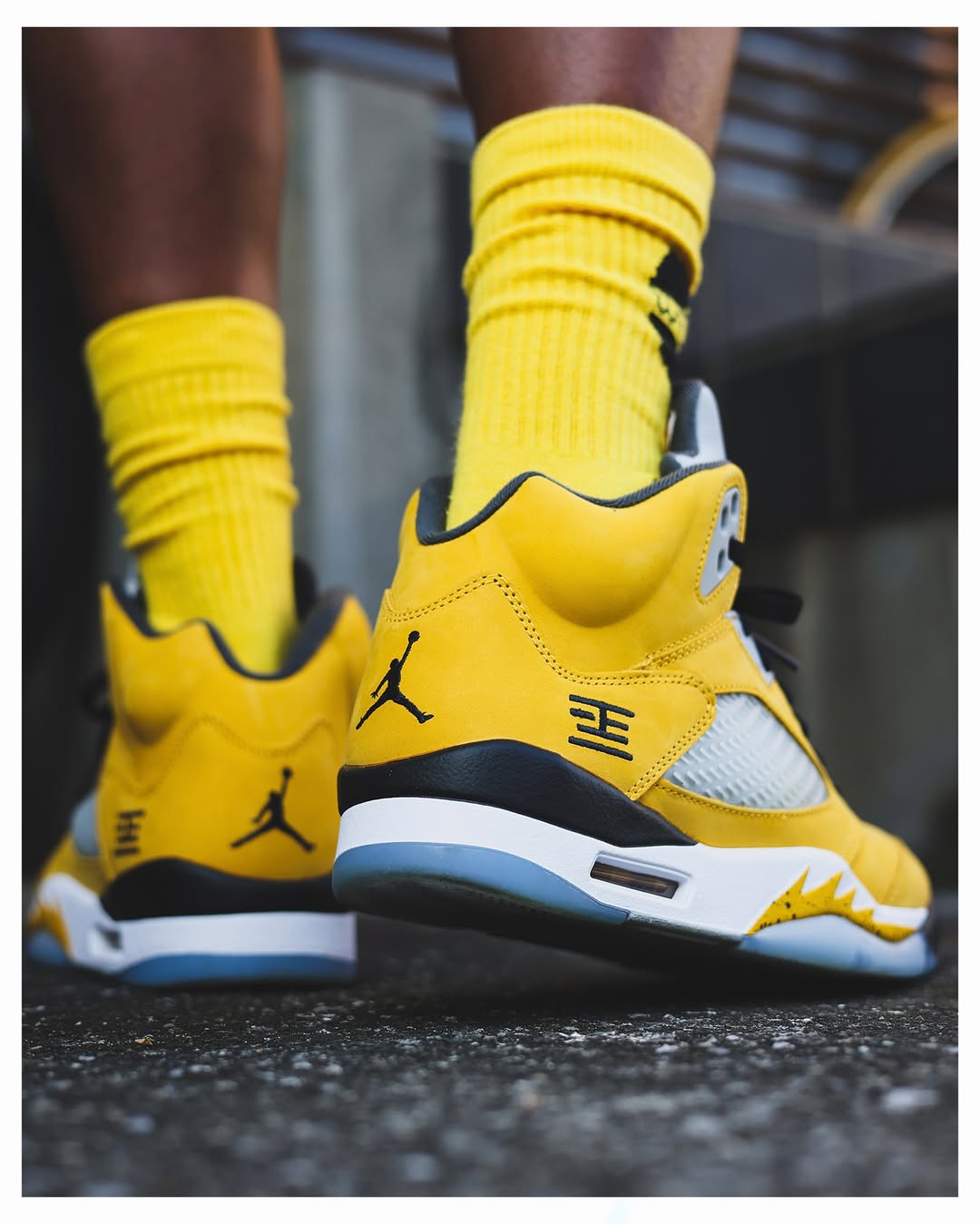 Side view of the Air Jordan 5 “Tokyo” featuring yellow upper and Tokyo 23 embroidery