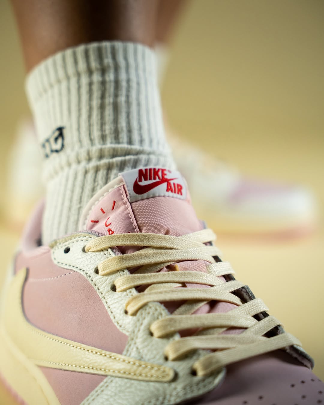 Travis Scott x Air Jordan 1 Low "Shy Pink" Close-up of the Air Jordan 1 Low OG “Shy Pink” on Travis Scott’s feet