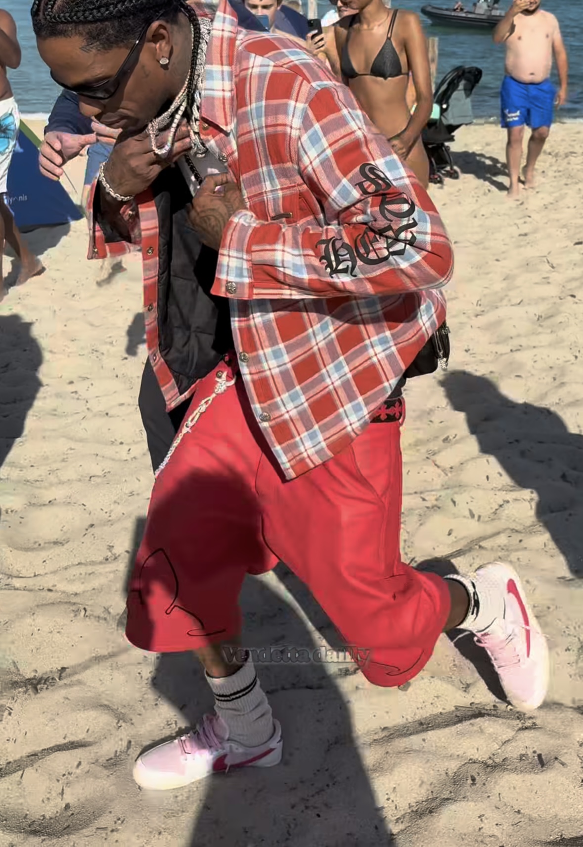 Travis Scott x Air Jordan 1 Low "Shy Pink" Travis Scott wearing the Air Jordan 1 Low OG “Shy Pink” at the beach