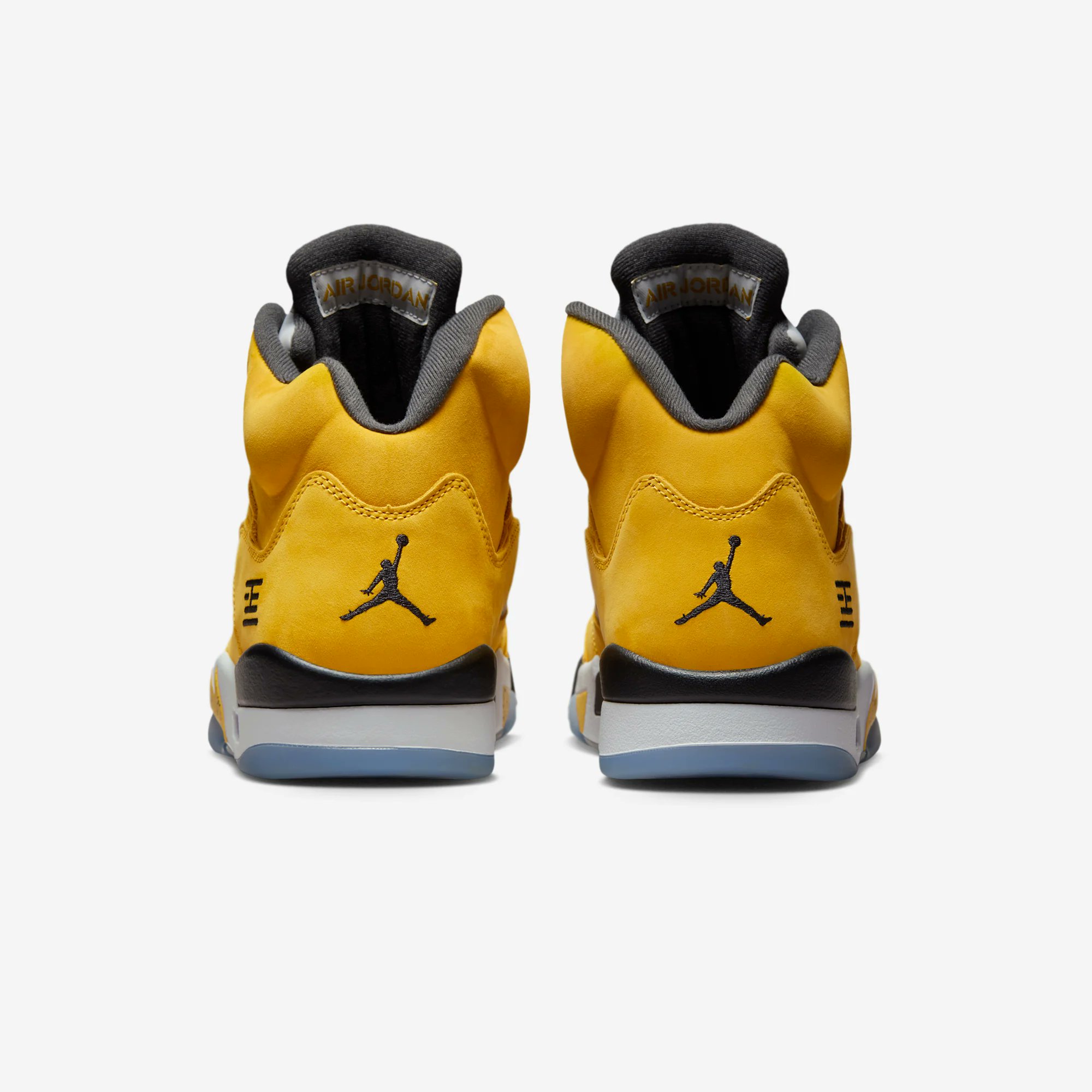 Side view of the Air Jordan 5 “Tokyo” featuring yellow upper and Tokyo 23 embroidery