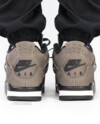 Heel shot of the Air Jordan 4 Cave Stone with Nike Air branding and suede finish