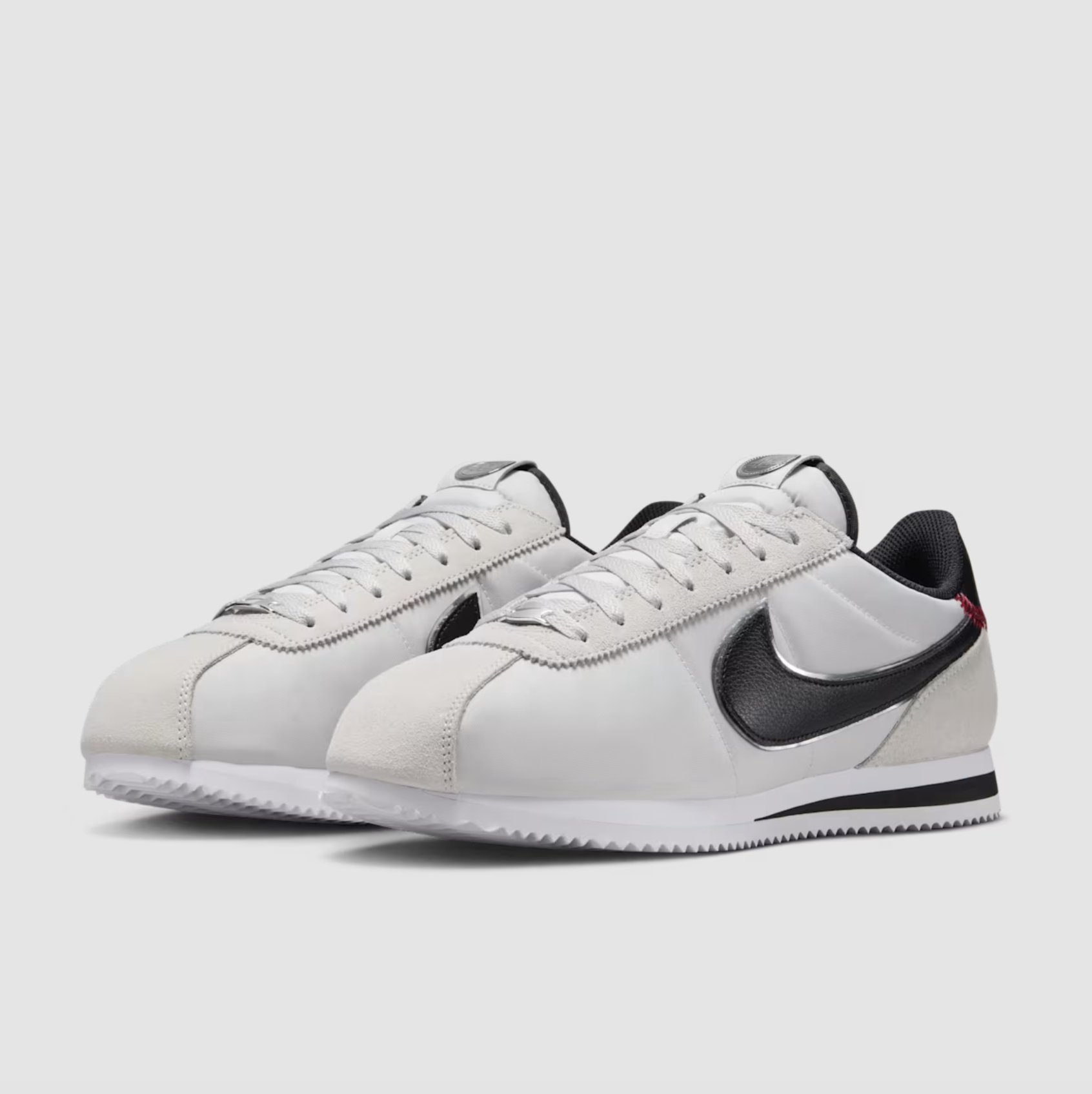 Nike Cortez Jackie Robinson Day Nike Cortez Jackie Robinson Day sneaker side profile with black Swoosh and baseball heel stitching