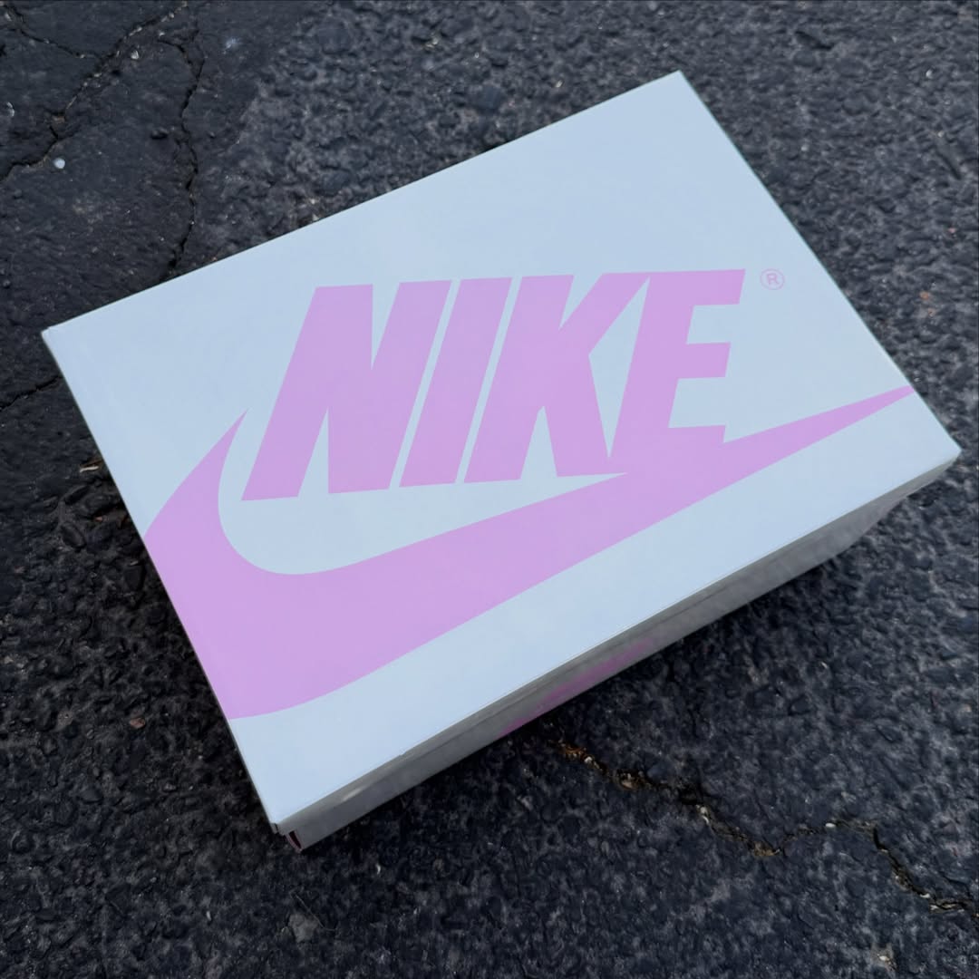 Travis Scott x Air Jordan 1 Low "Tropical Pink" in hand