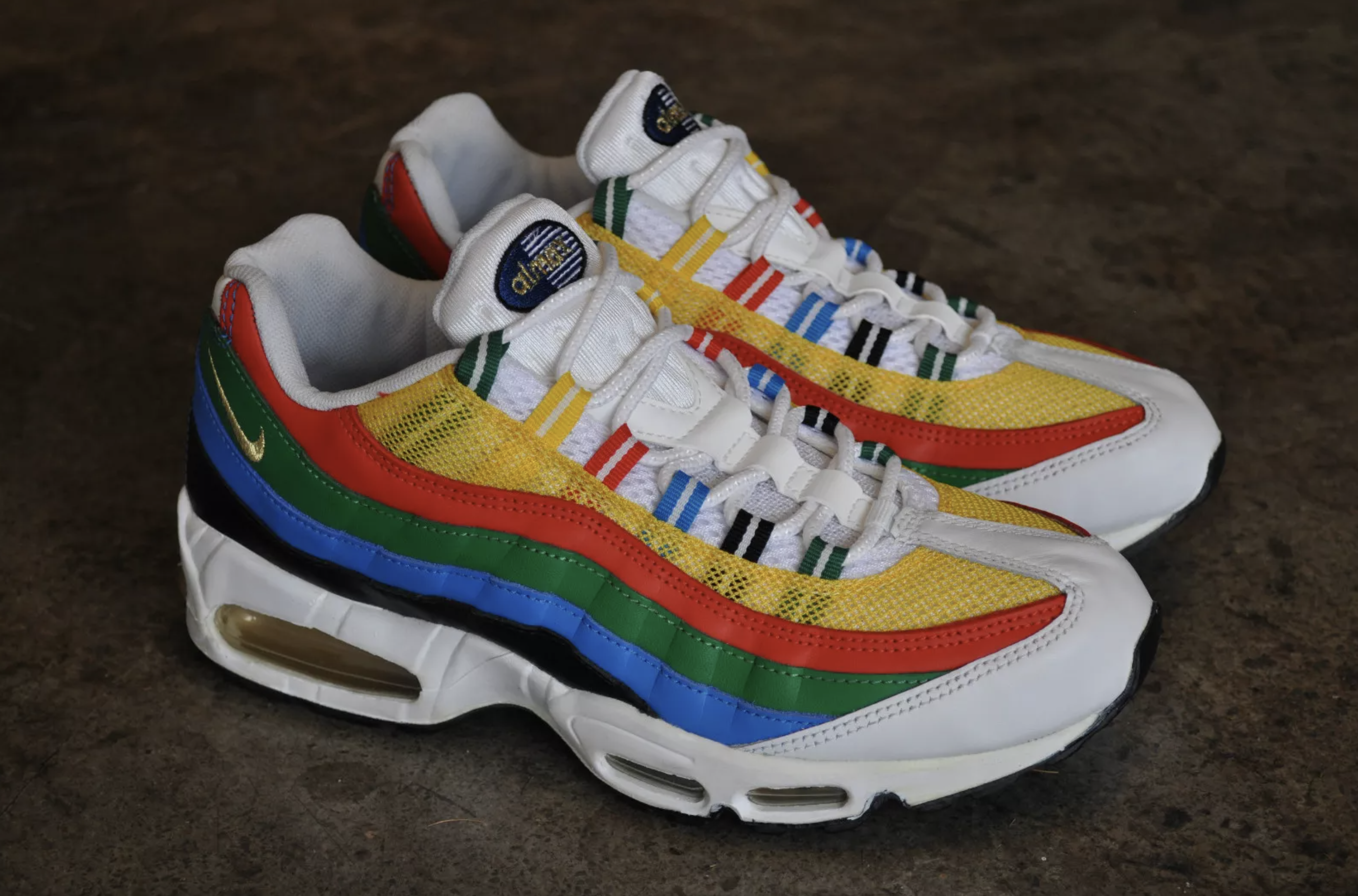 Detailed first look at the 2026 Nike Air Max 95 Olympic returning edition with vibrant red, yellow, green, blue, and black overlays.