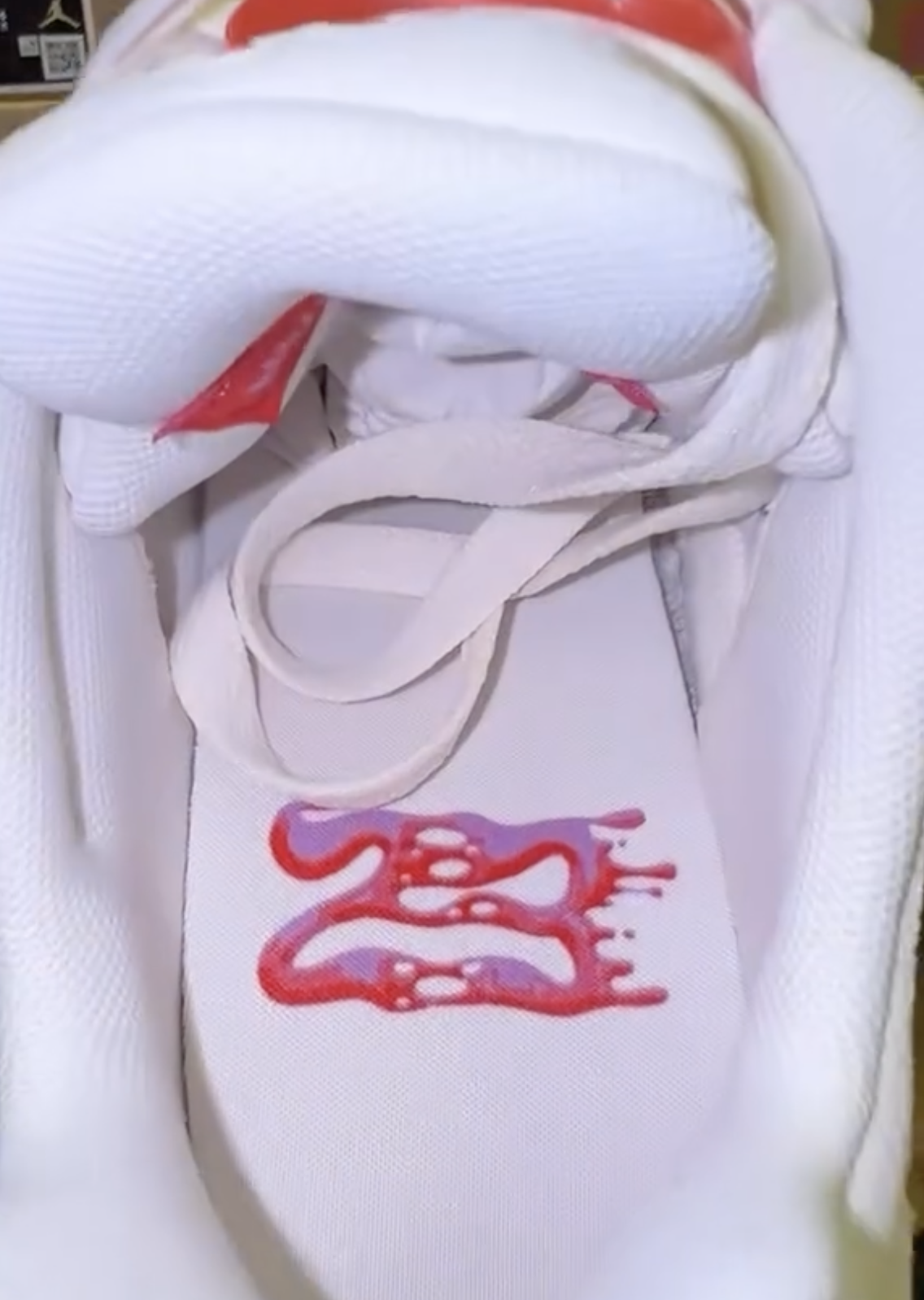 Insole graphic of the Air Jordan 5 Low GS Peanut Butter & Jelly featuring dripping “23” graphic