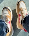 Heel view of the Tom Sachs x Nike Mars Yard 3.0 with red pull tab and mesh upper.
