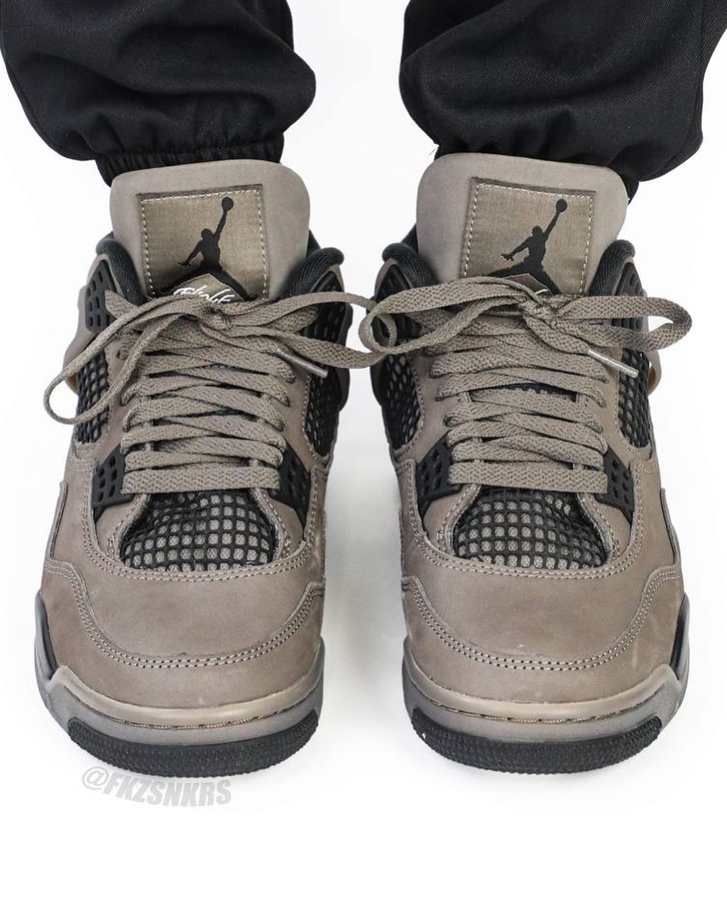 Air Jordan 4 Cave Stone Front angle on-foot look at the Air Jordan 4 Cave Stone showing tongue and lacing