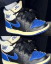 Close-up of the Fragment x Union x Air Jordan 1 High “Sport Royal” with blue overlays and visible Nike Air branding.