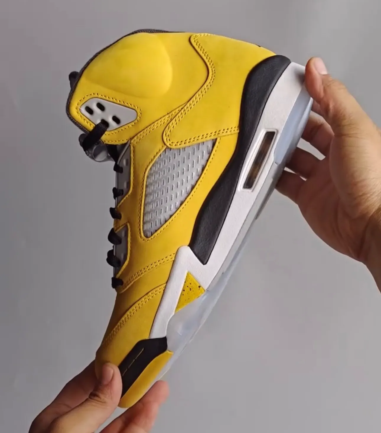 Medial side of the Air Jordan 5 “Tokyo” with mesh panel and black midsole