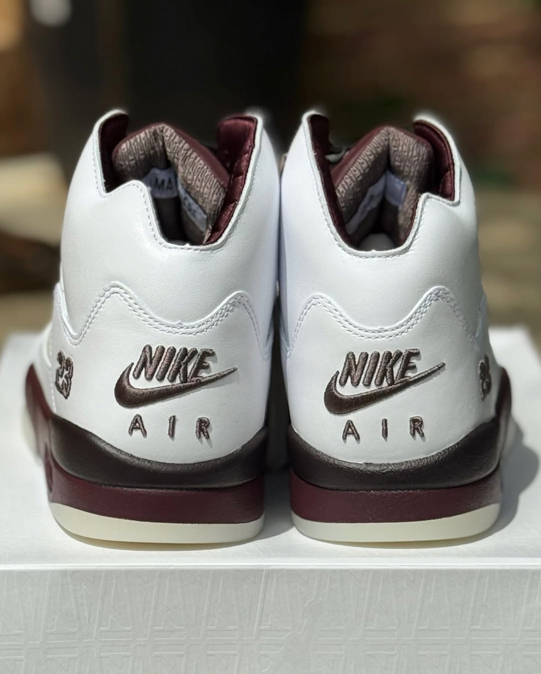 Side angle showcasing the burgundy midsole on the A Ma Maniére Air Jordan 5 Violet Ore