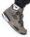 Air Jordan 4 Cave Stone on-foot side view with brown suede and black mesh