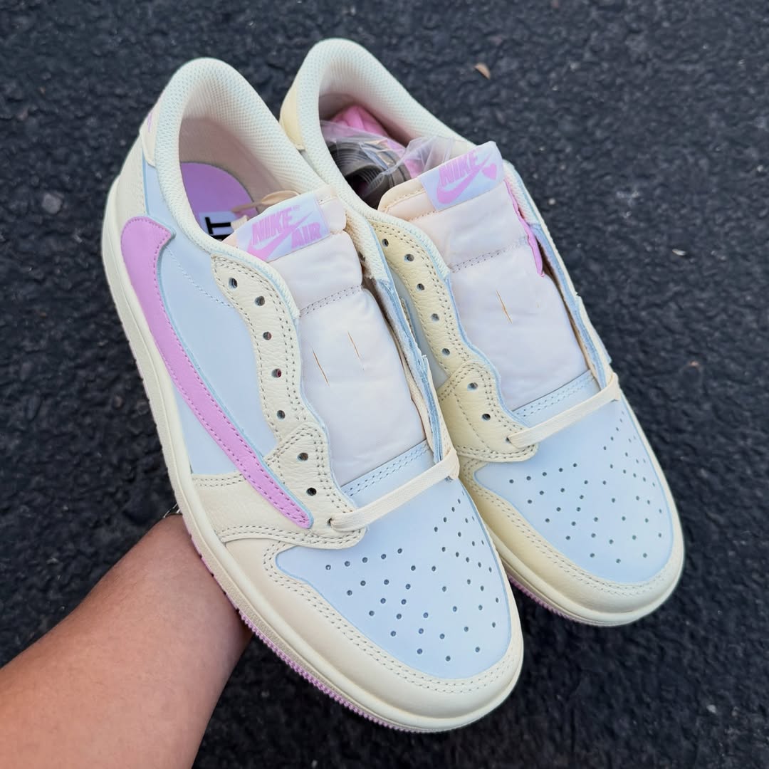 Close-up of the Air Jordan 1 Low OG “Shy Pink” in hand