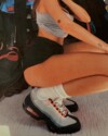 On-foot look at the Nike Air Max 95 “Bright Mandarin” Summer 2025 sneaker featuring orange eyelets and gradient grey upper worn bei Veneda Carter