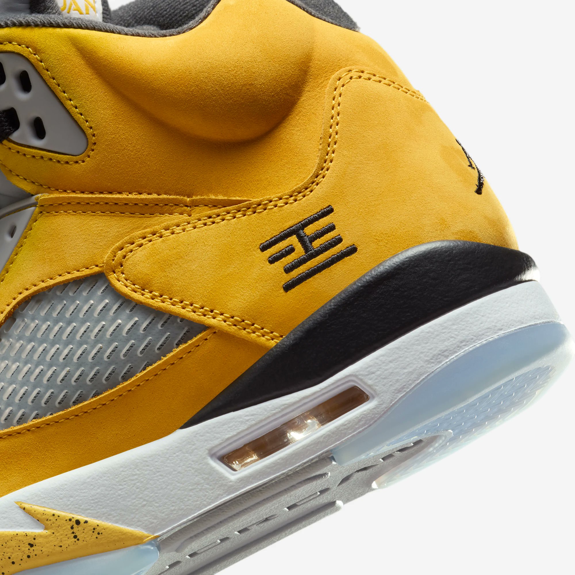 Side view of the Air Jordan 5 “Tokyo” featuring yellow upper and Tokyo 23 embroidery