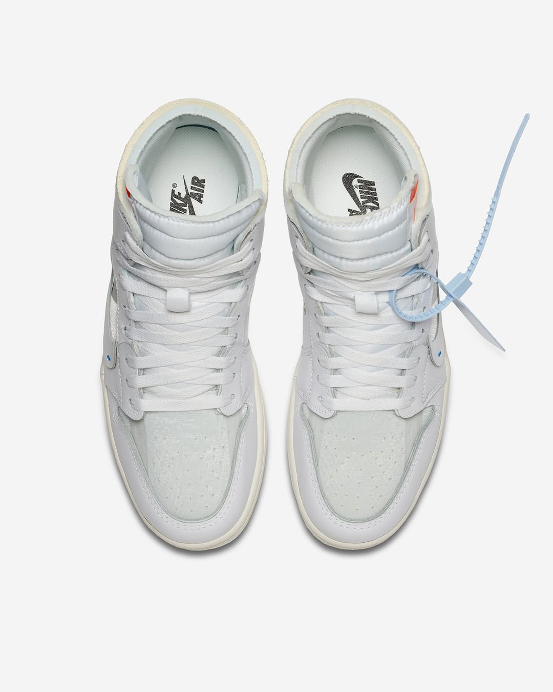 Front angle of Off-White x Air Jordan 1 High “Alaska” showing stitched Swoosh and translucent accents.