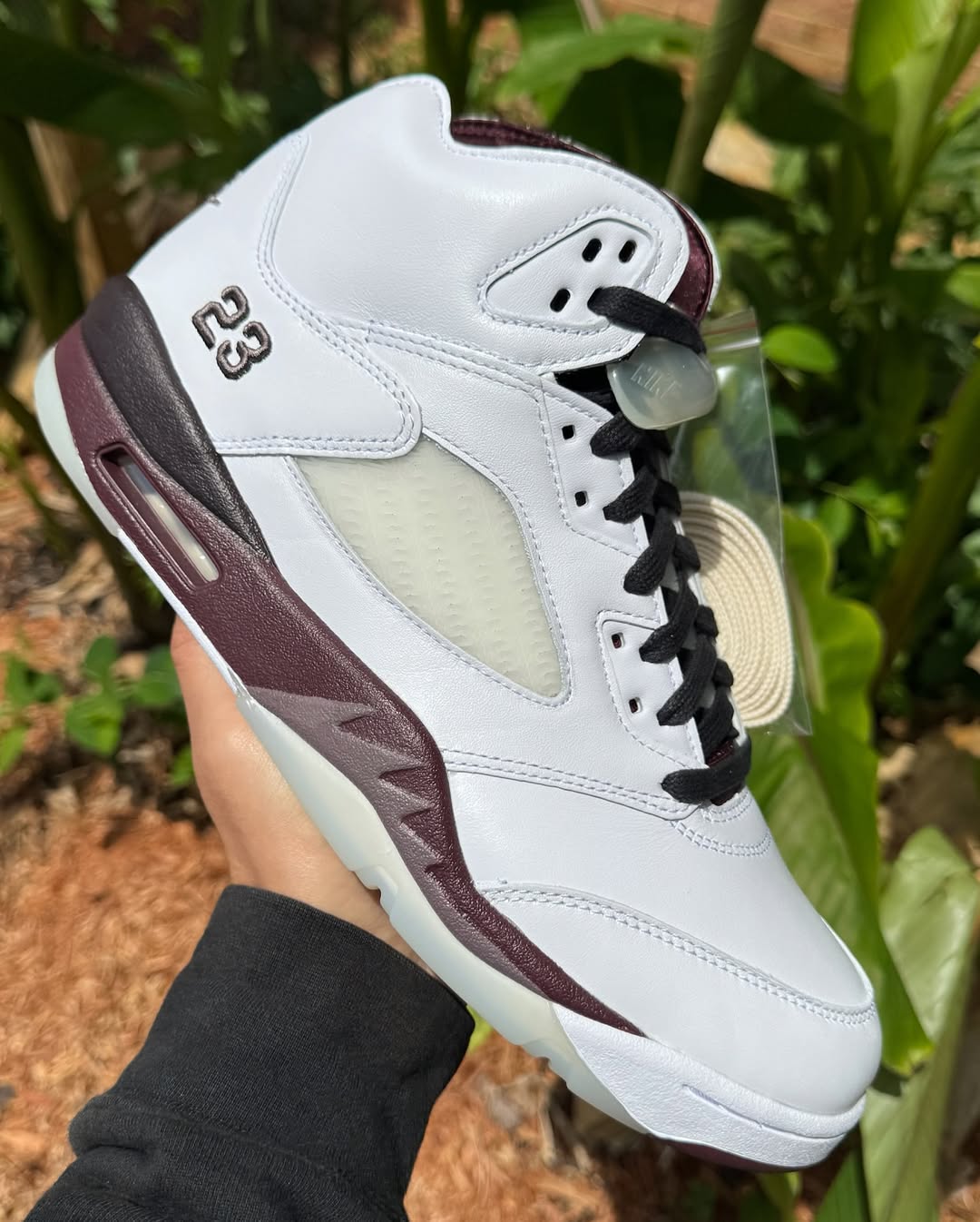 Side angle showcasing the burgundy midsole on the A Ma Maniére Air Jordan 5 Violet Ore