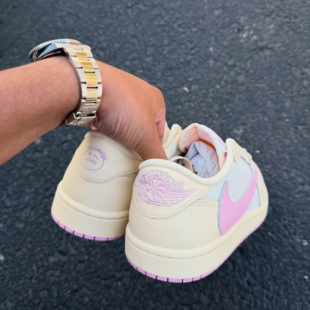 Close-up of the Air Jordan 1 Low OG “Shy Pink” in hand