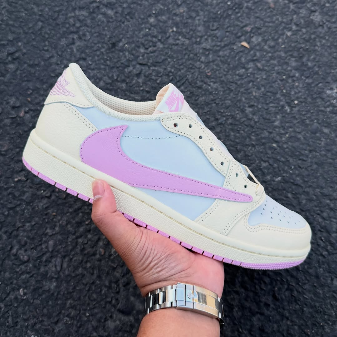 Close-up of the Air Jordan 1 Low OG “Shy Pink” in hand